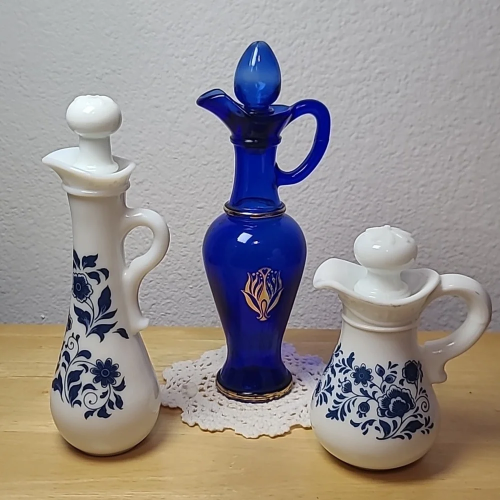 Avon set of three milk glass and blue glass pitcher.